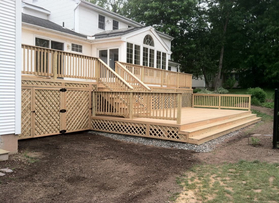 Regan Total Construction built this two level deck with custom storage