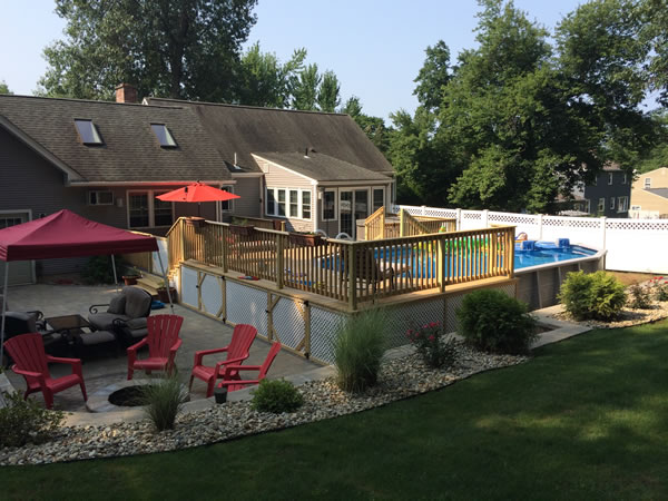 Pool deck with natural wood, rails, storage & lattice