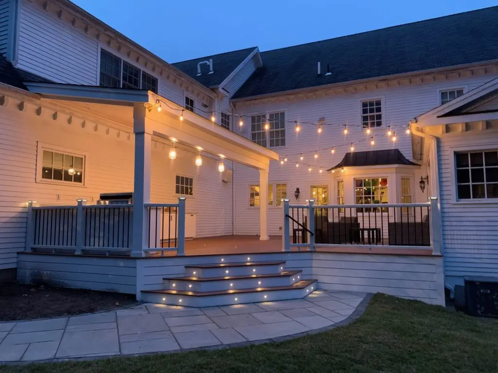 Evening Picture of Deck Lighting with Outdoor kitchen