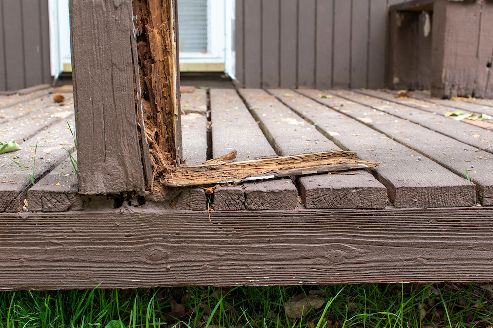 Old wooden deck that is rotting and needs to be replaced