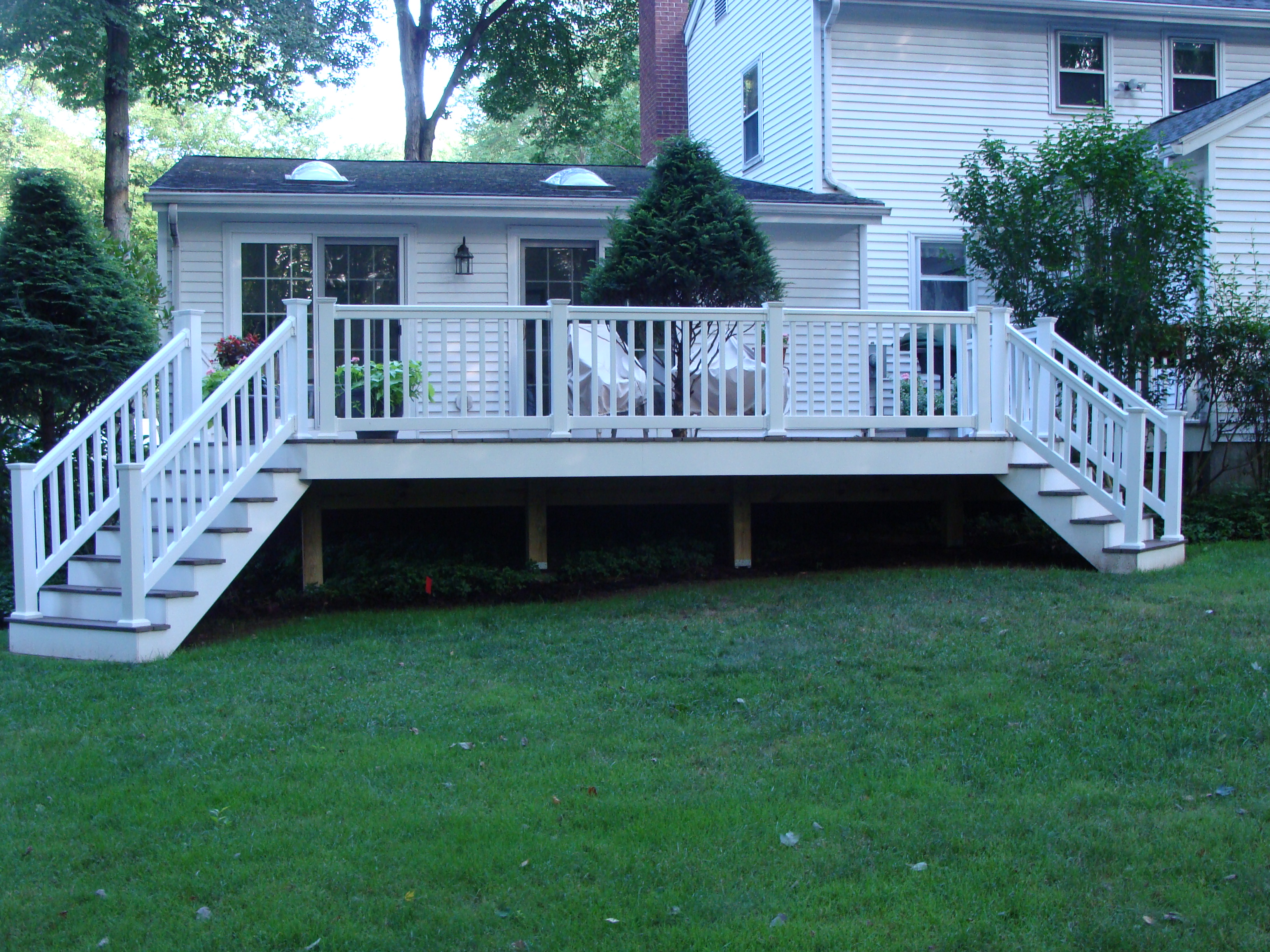 Composite deck with white railings - built by Decks by RTC