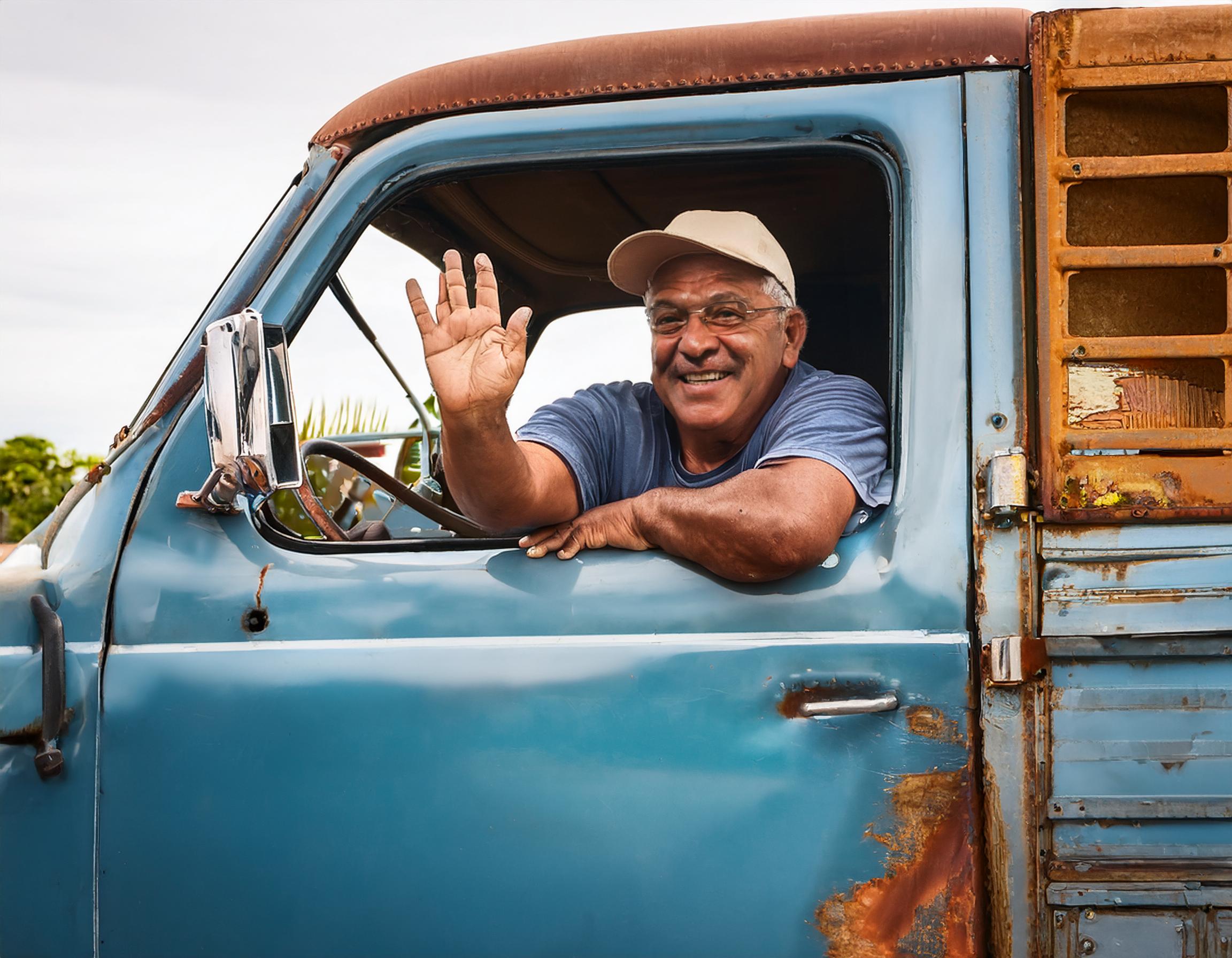 Handyman is a rusty old truck driving away from job site