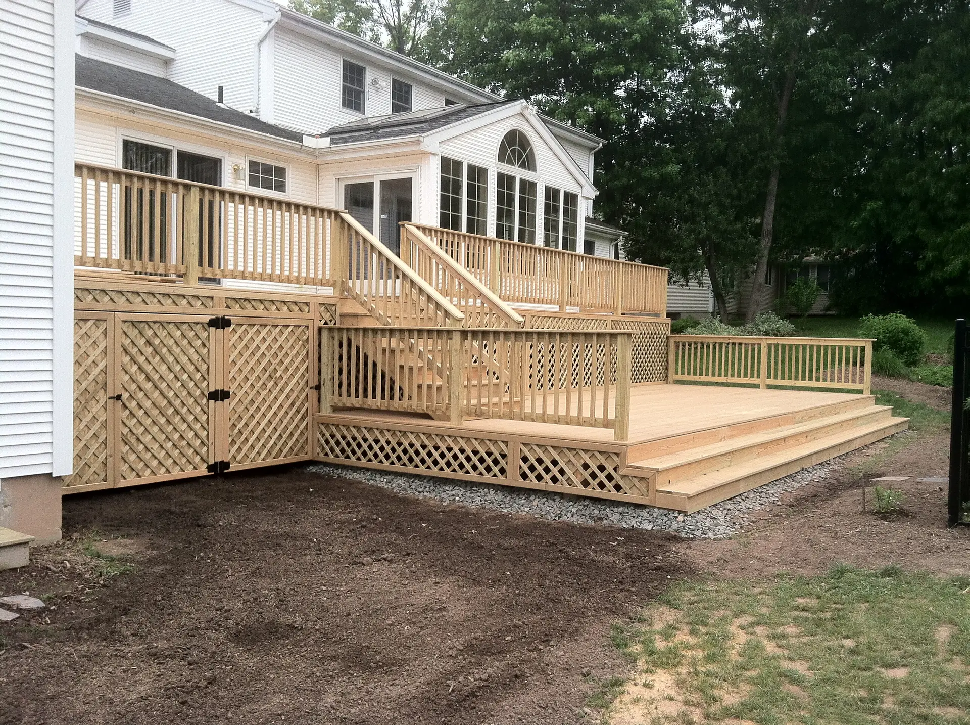 Two-Level Natural Wood Deck with Storage in Windsor, CT