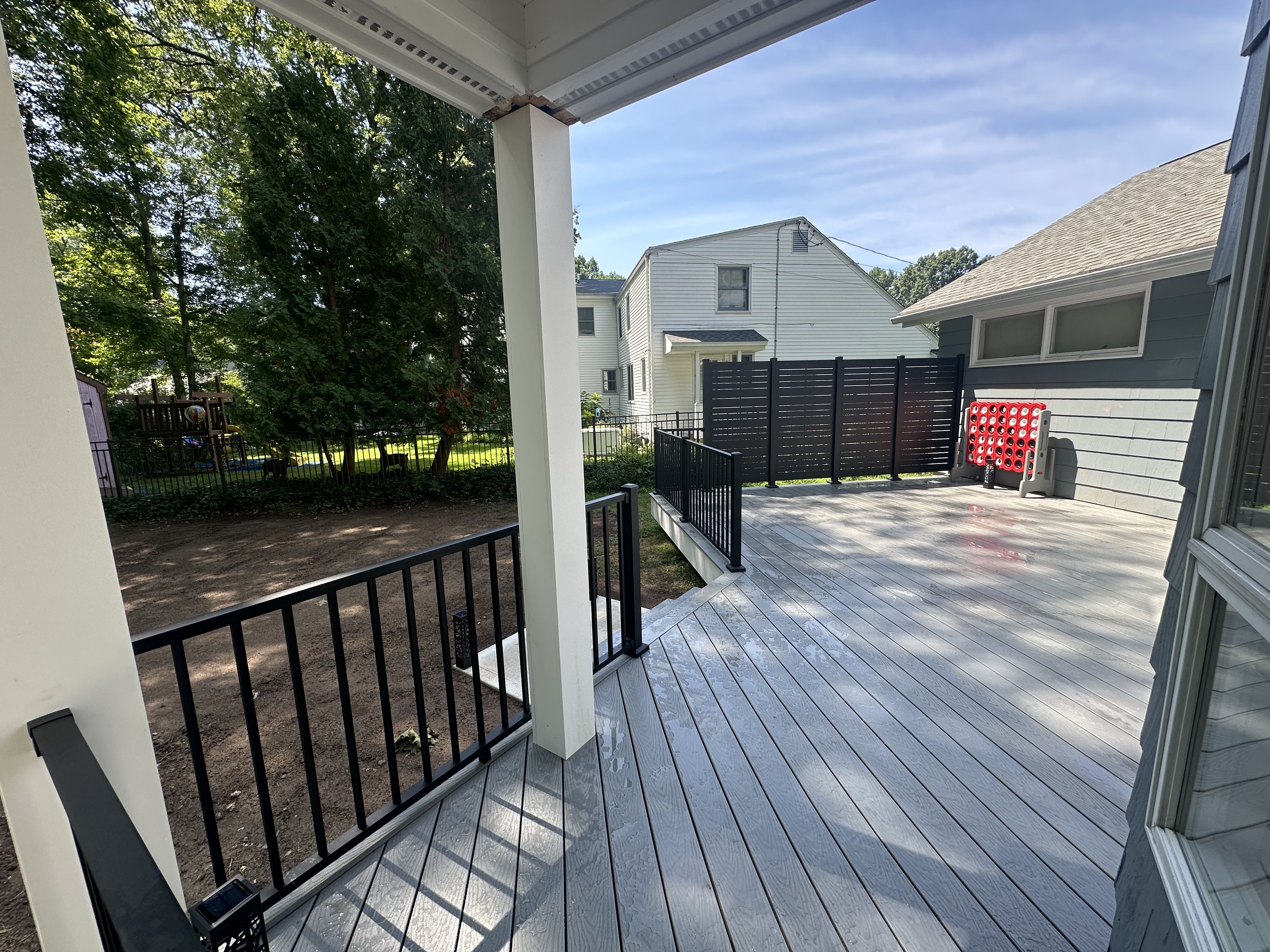 Trex Select® Pebble Grey Deck with White Vinyl Trim and Hideaway Privacy Screens – West Hartford