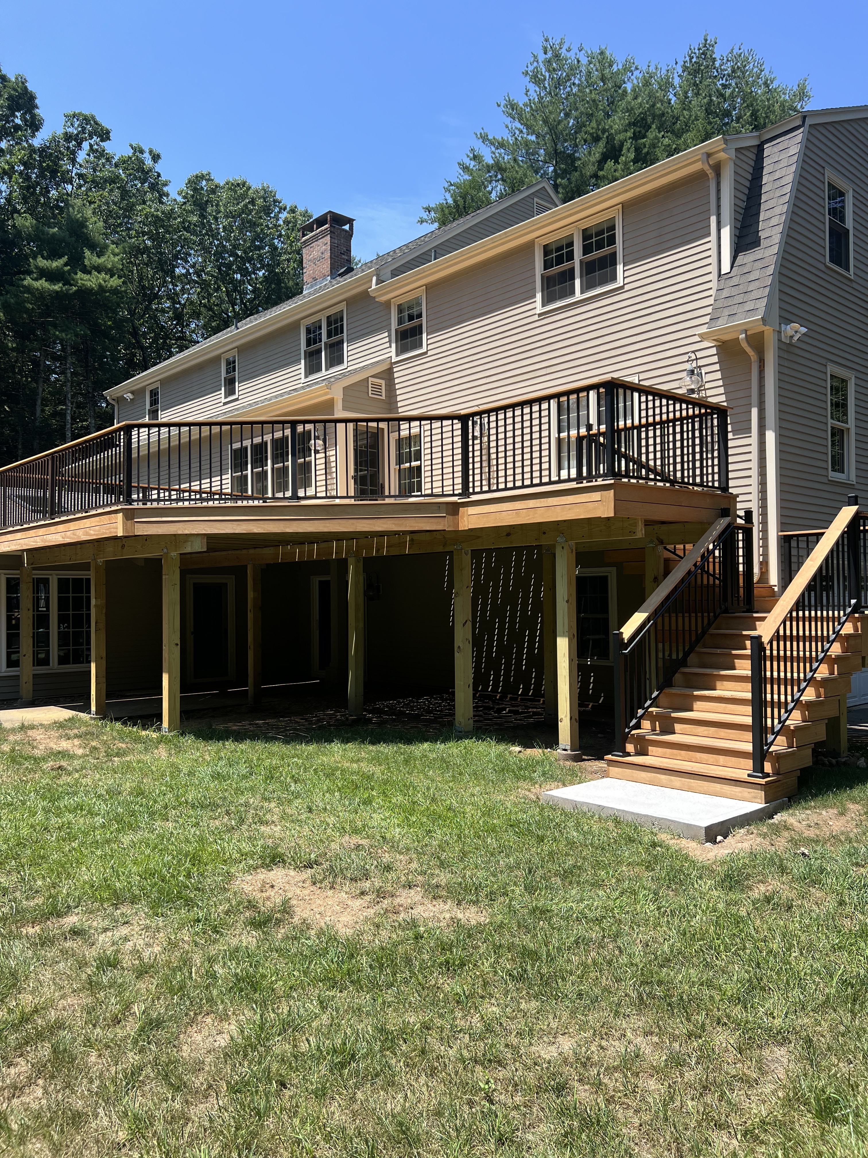 Garapa Hardwood Deck with Black Powder Coated Trex Signature® Railings – Simsbury, CT